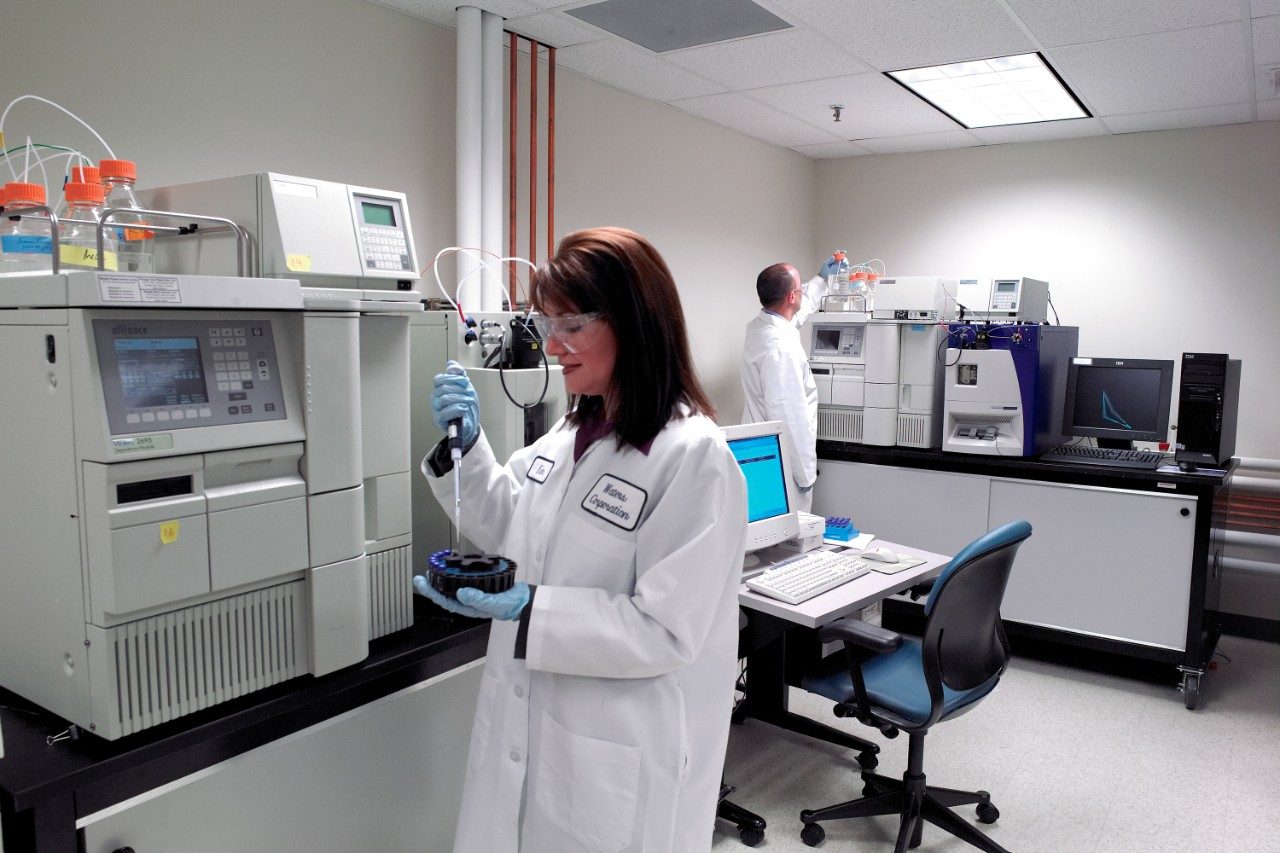 Scientists working with Alliance HPLC System