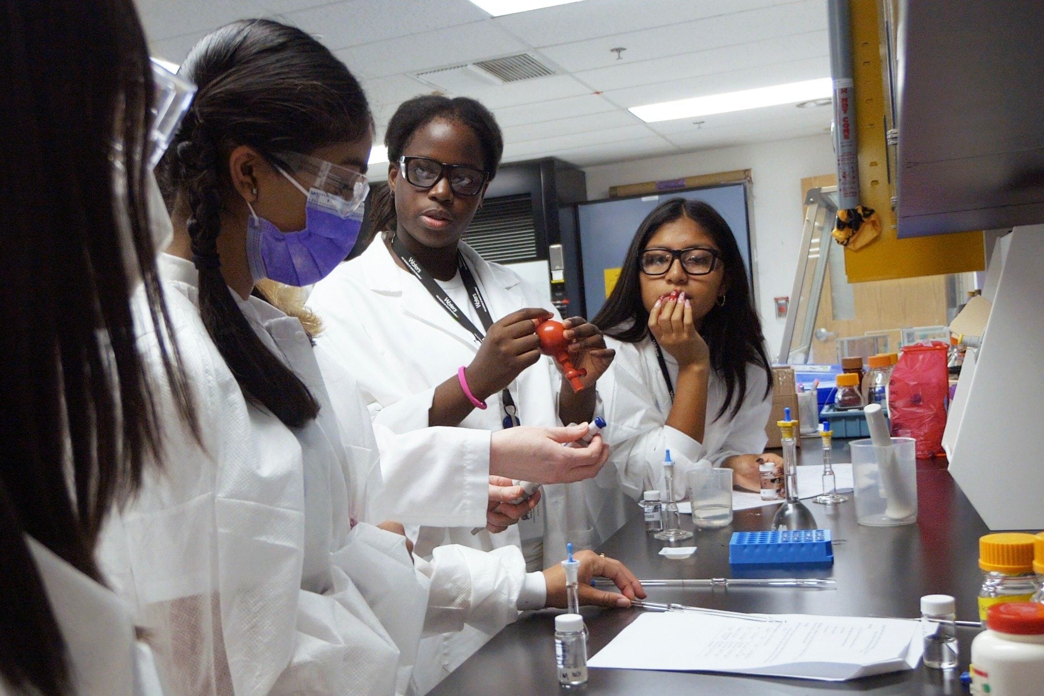 Four female scientists in Waters STEM program