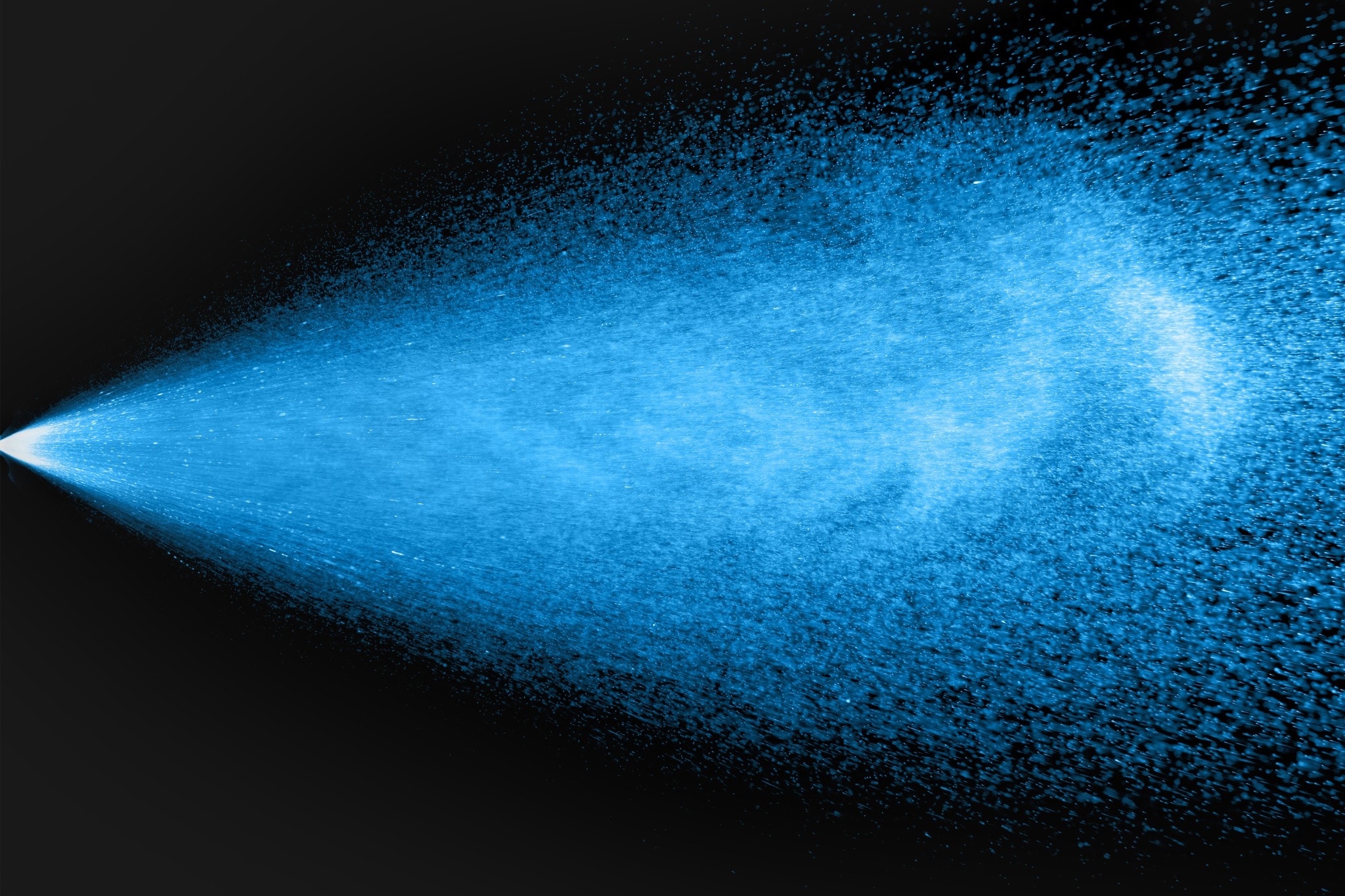 Spray stream of blue particles