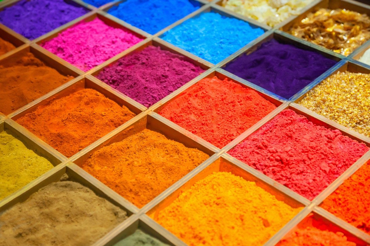 Colorful sands in wooden box