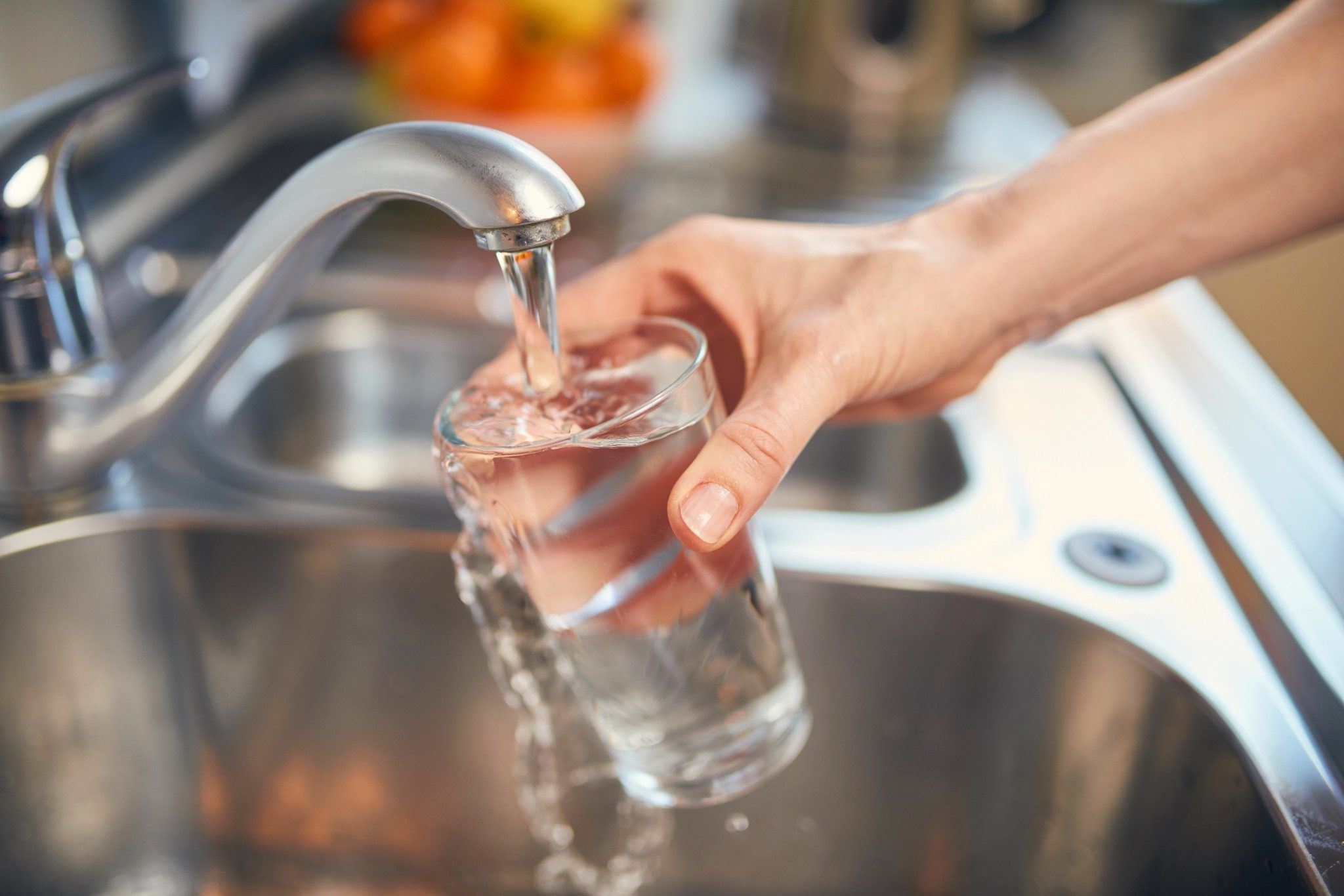 Pouring Fresh Tap Water Into a Glass 