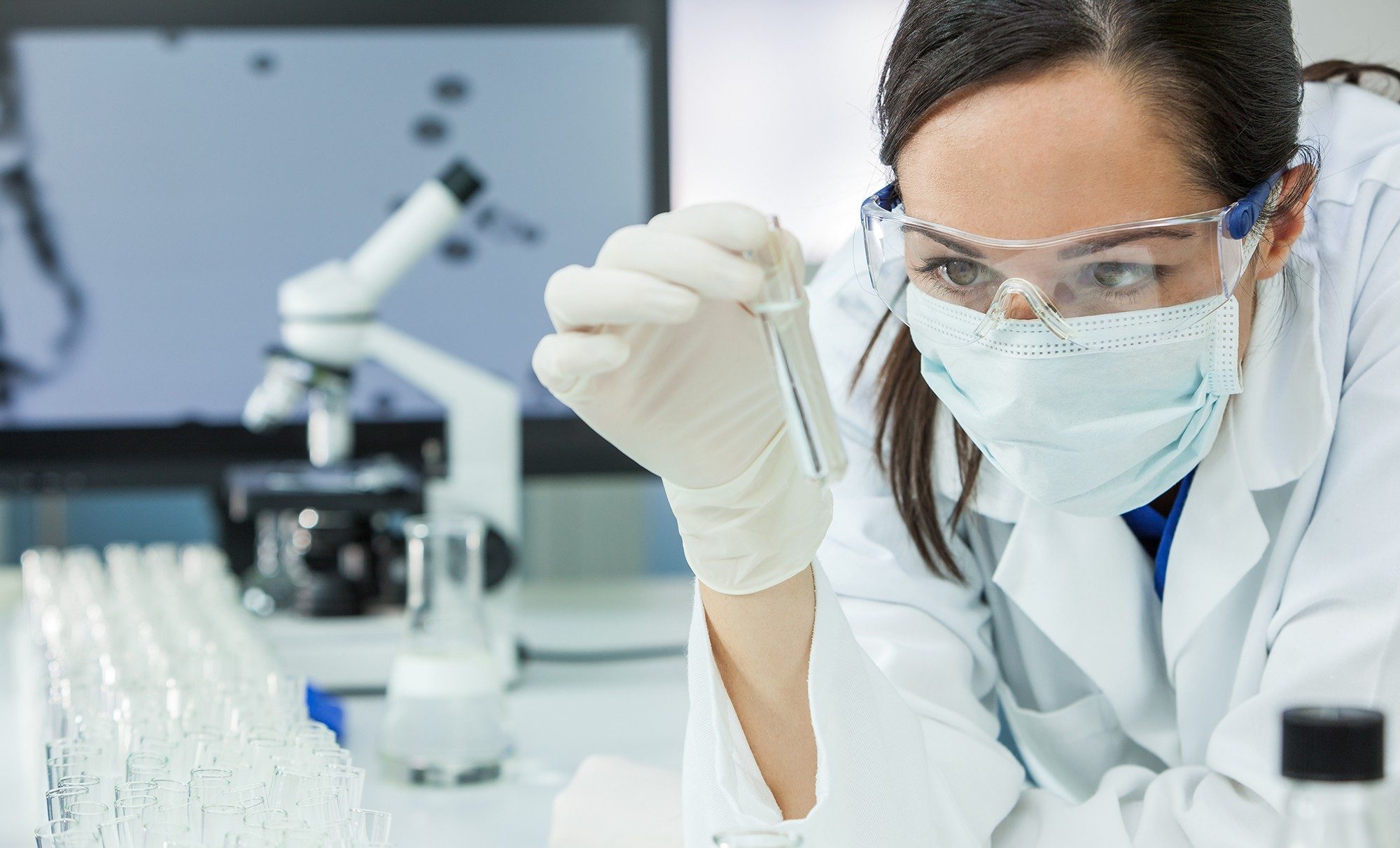 Woman Doctor With Test Tube In Laboratory