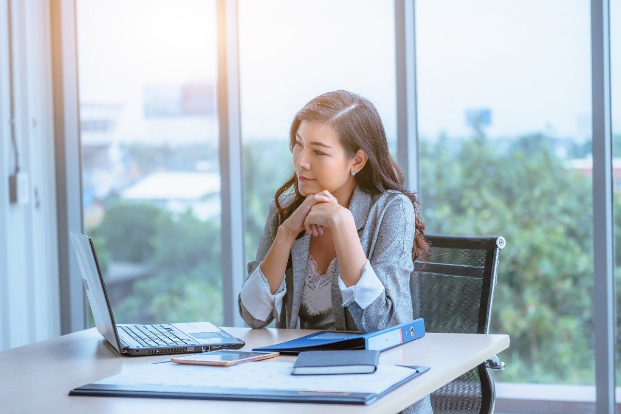 Manager working remote listening in meeting